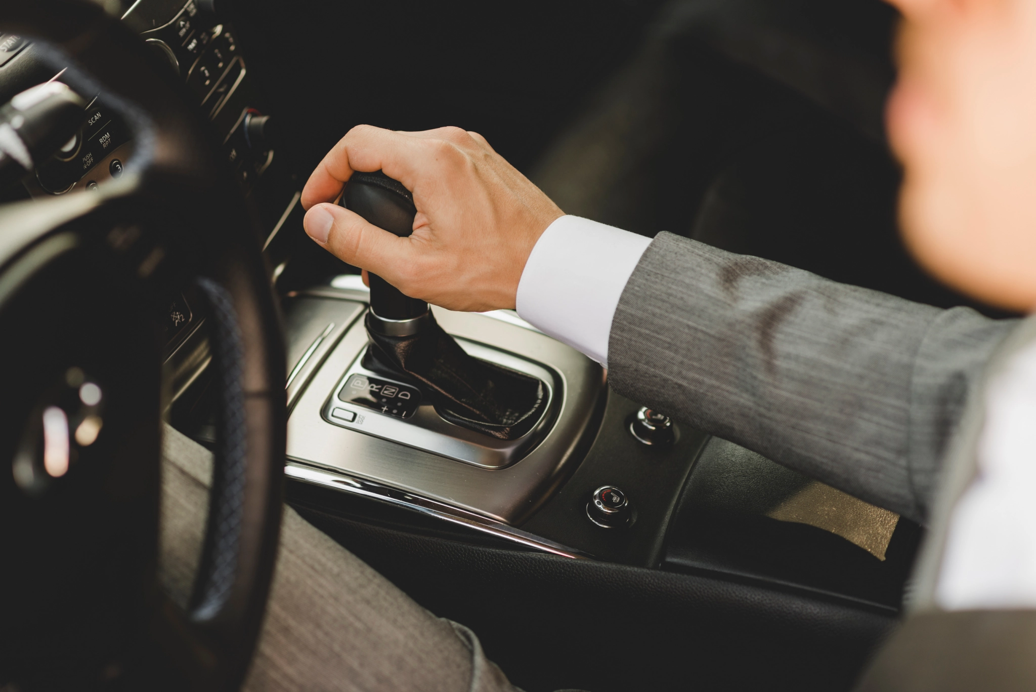 Elevated view businessman driving car moving transmission shift gear